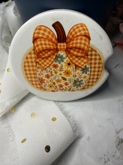 Car Coaster with a checkered bow and floral design on a white background