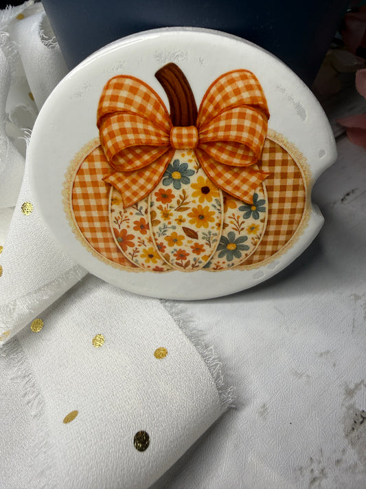 Car Coaster with a checkered bow and floral design on a white background